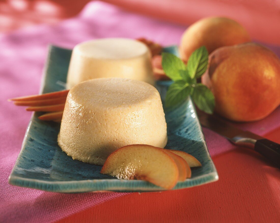 Peach yoghurt mousse with peach slices on plate