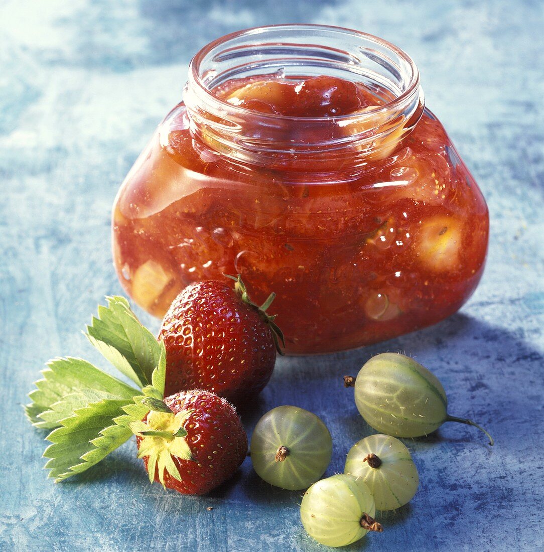 Gooseberry and strawberry jam in a jam jar