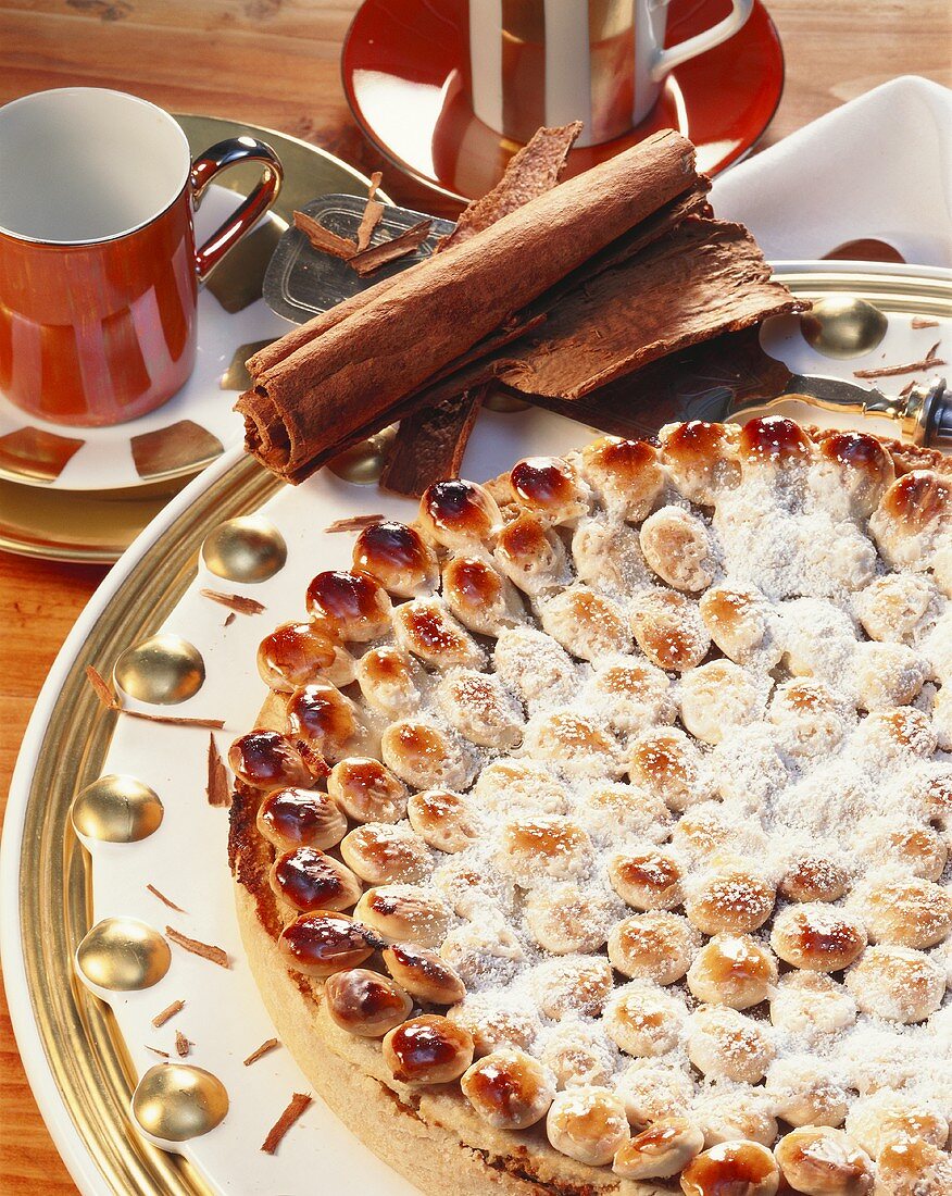 Almond & cinnamon tart with toasted almonds & icing sugar