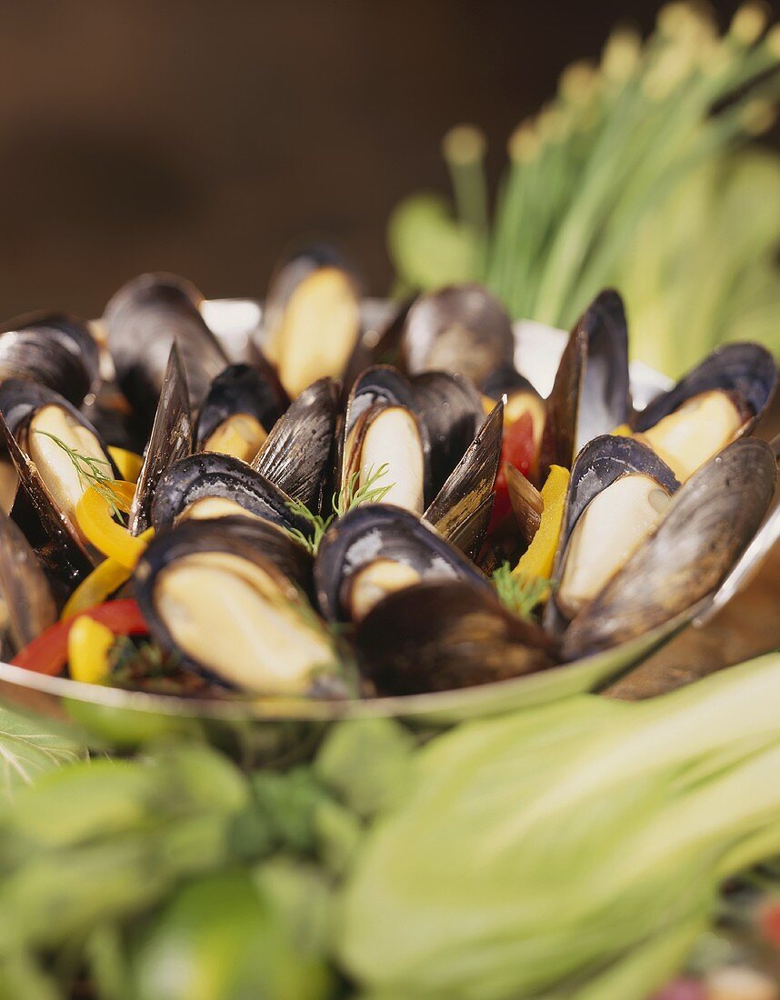Steamed mussels with pepper strips in a bowl
