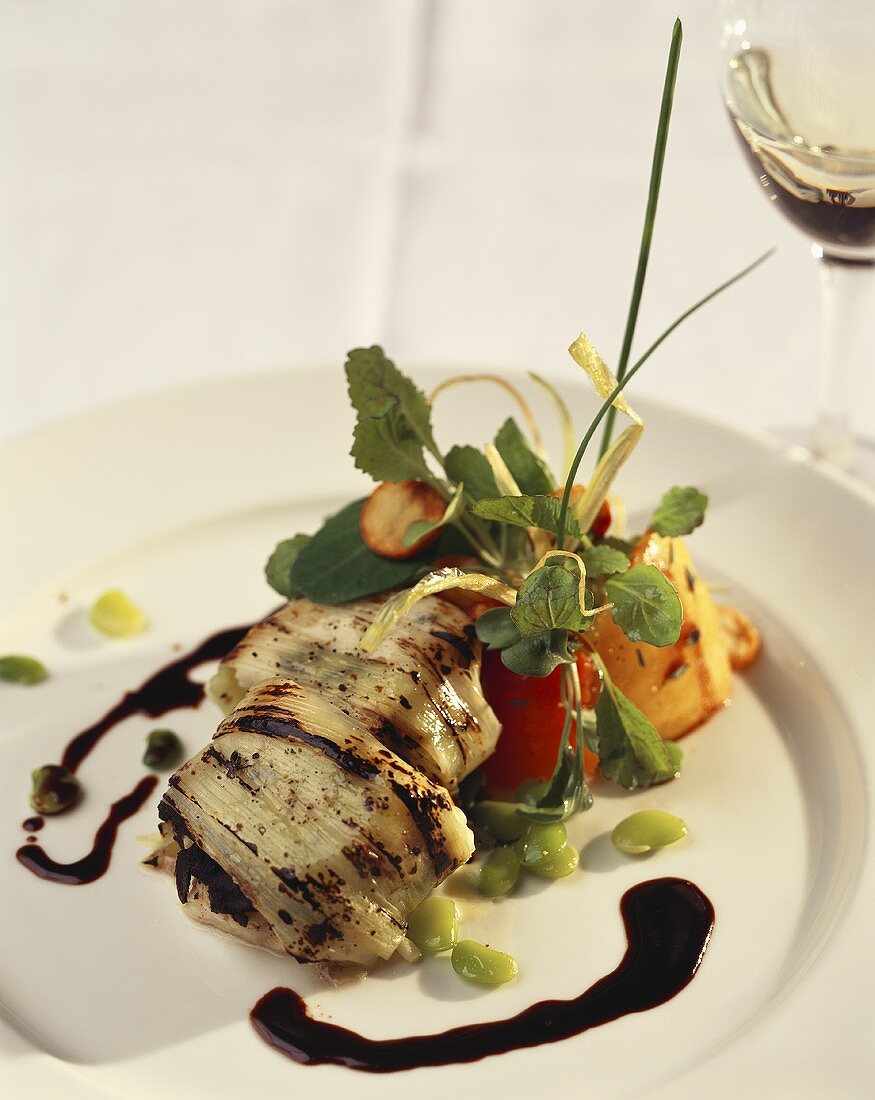 Chicken breast in leek with balsamic sauce and vegetables