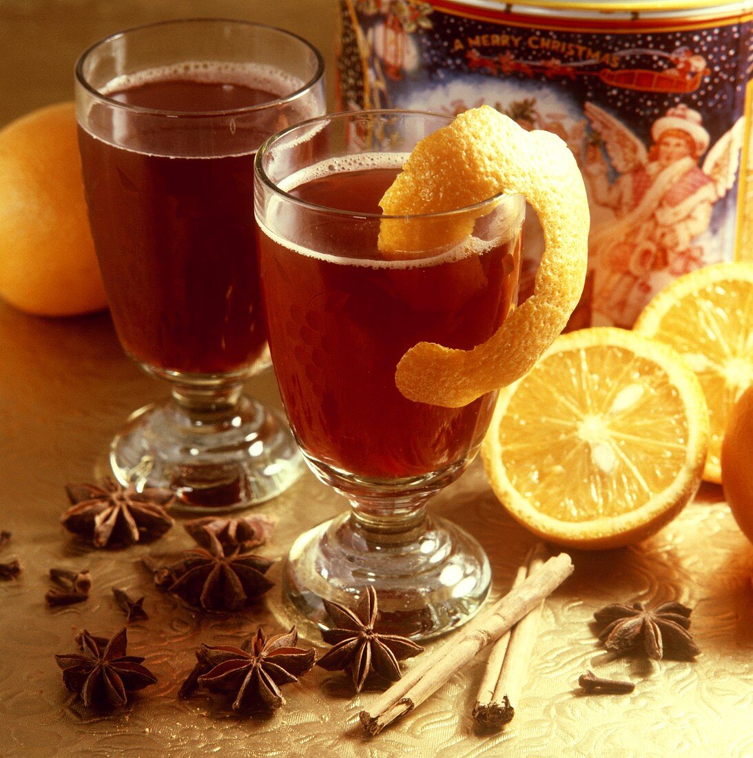 Two glasses of red wine punch with orange peel