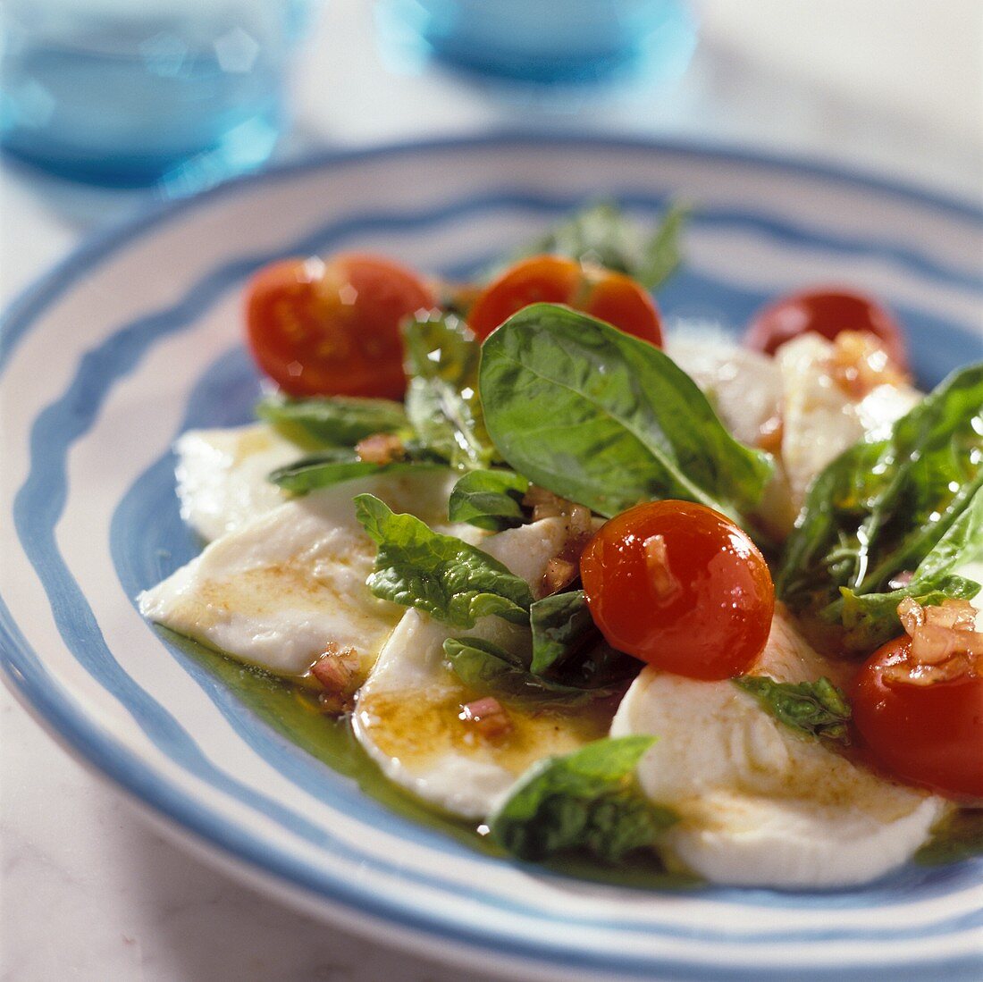 Spinach and tomatoes on mozzarella