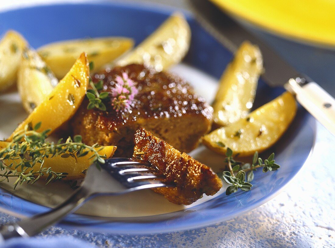 Frikadeller with thyme potatoes on plate