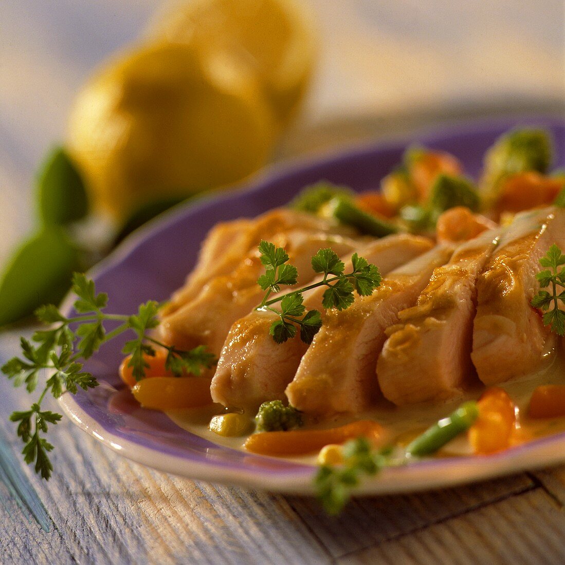 Chicken breast in chervil sauce with vegetables