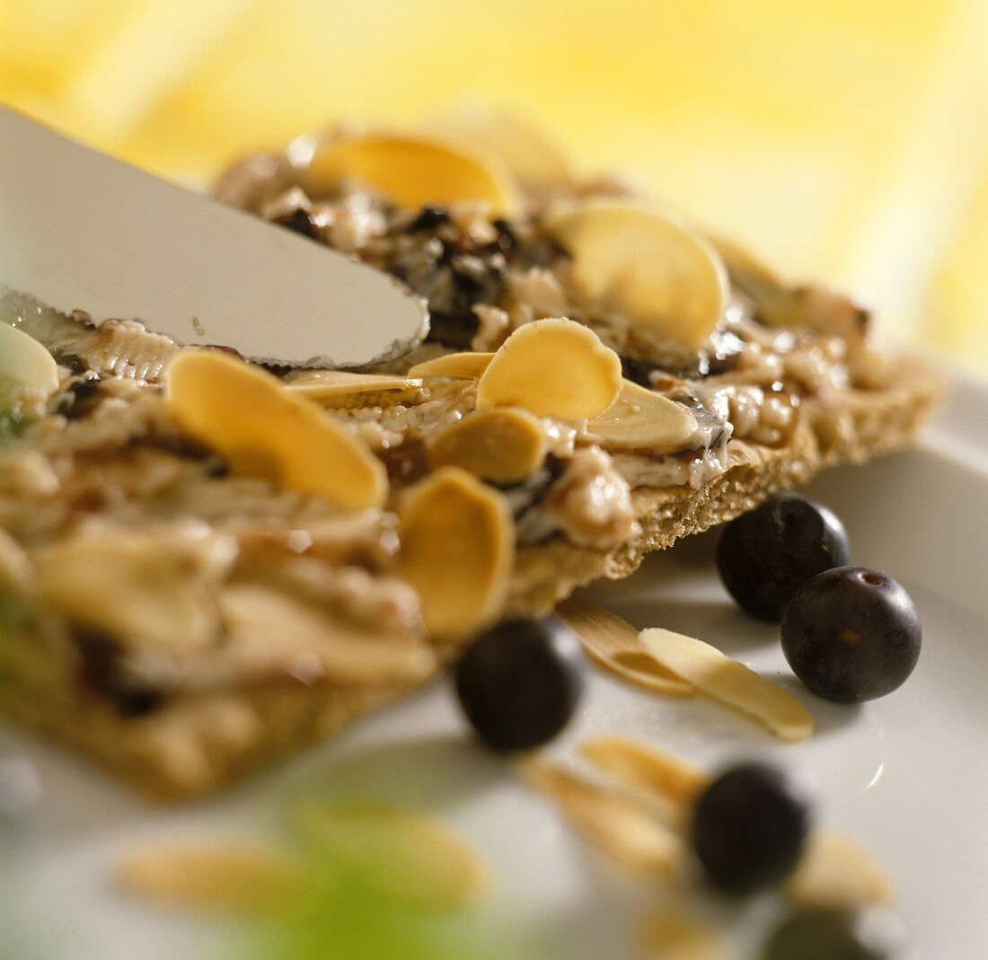 Crispbread with blueberry butter and almond flakes