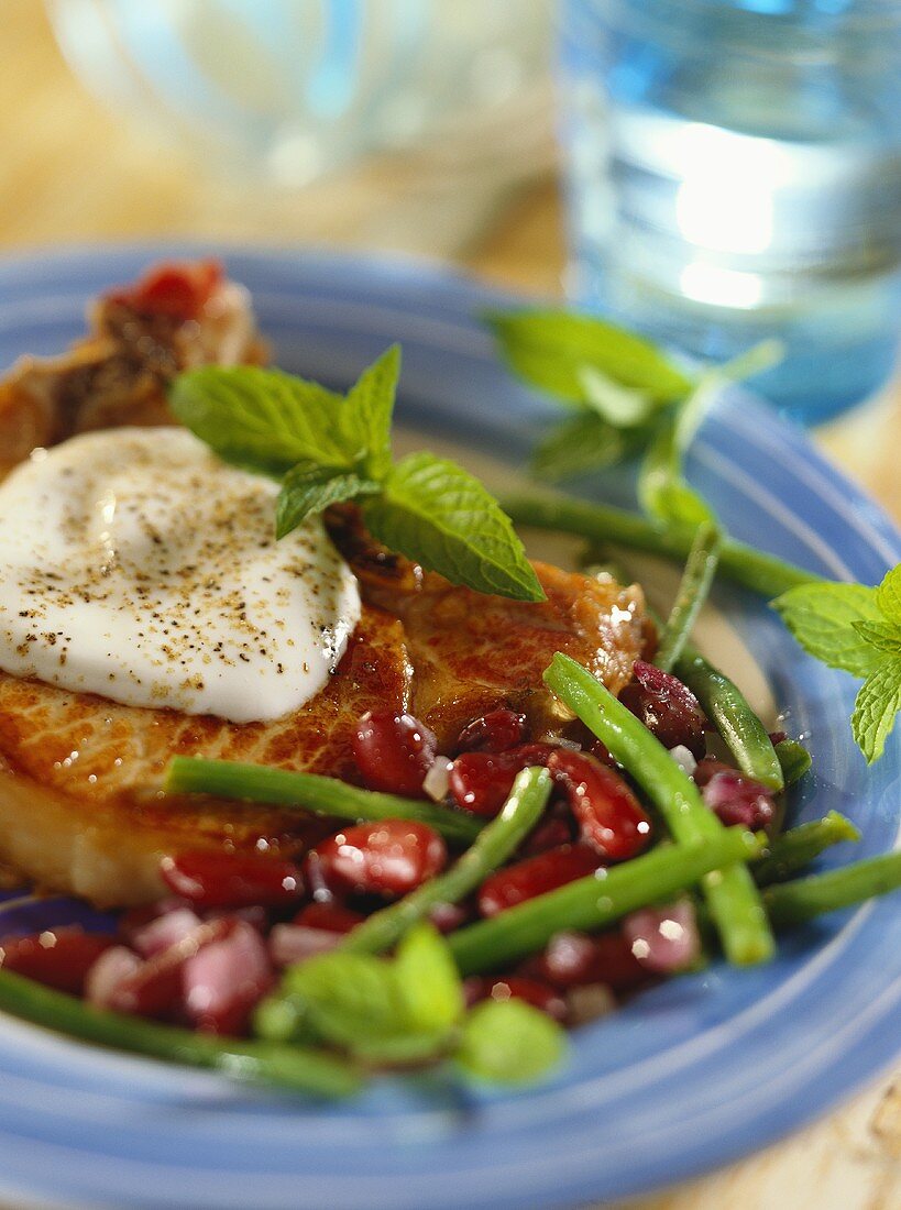 Pork chop with beans and yoghurt 