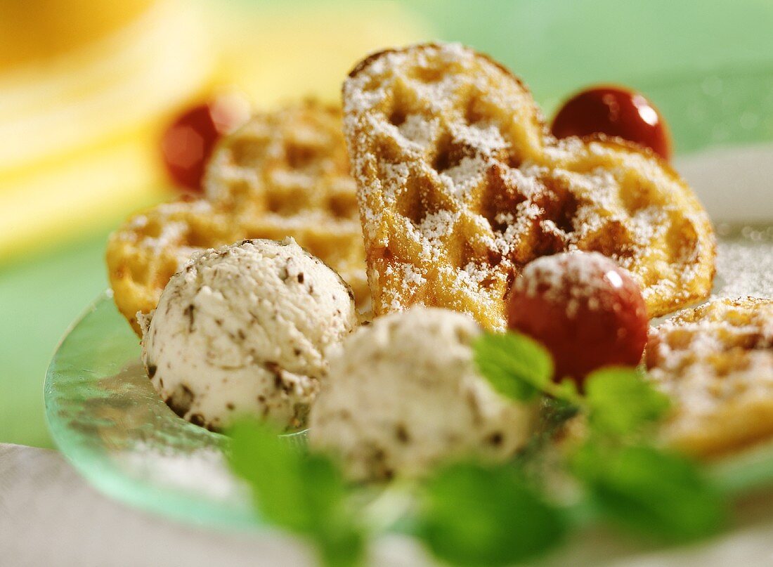 Cherry waffles with ice cream and icing sugar