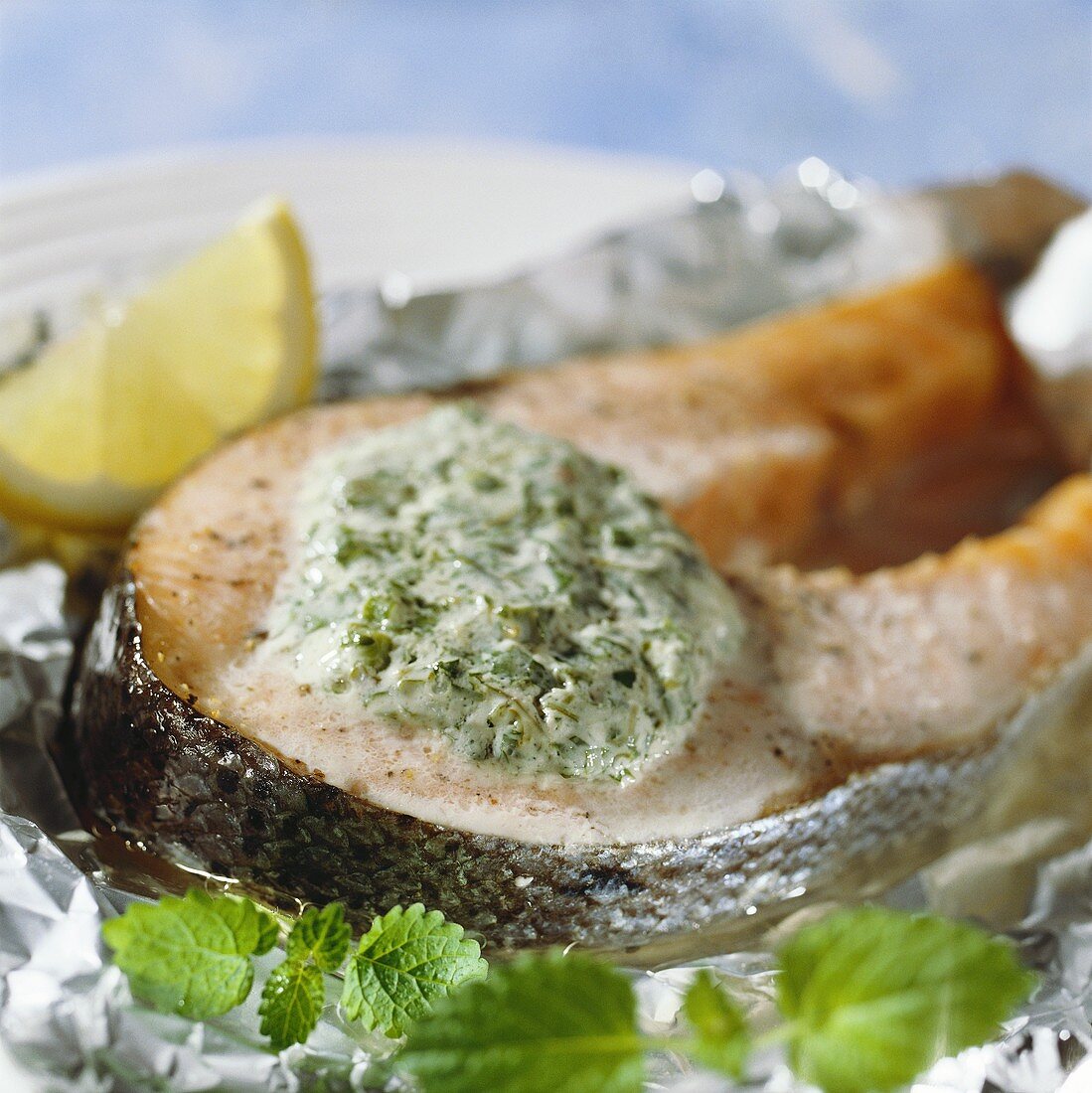 Salmon cutlet with herb mousse on aluminium foil