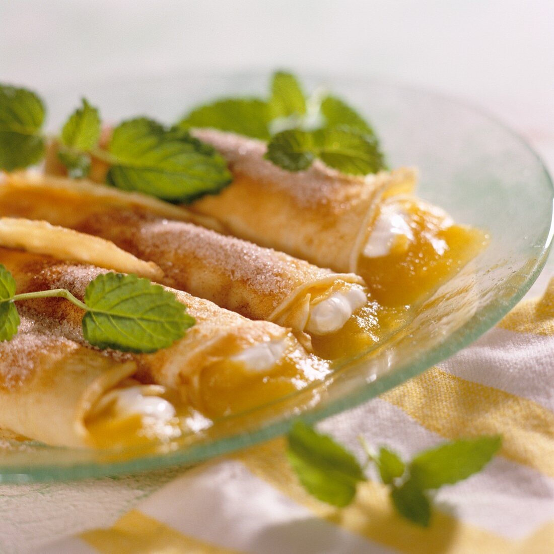 Pancake rolls with apricot puree and lemon balm