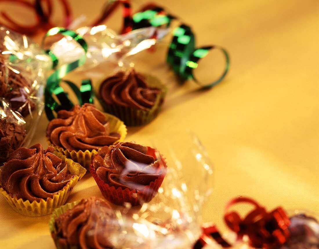 Chocolates in paper cases and cellophane paper