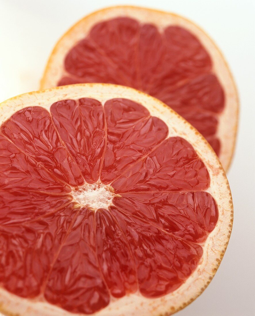 Two pink grapefruit halves