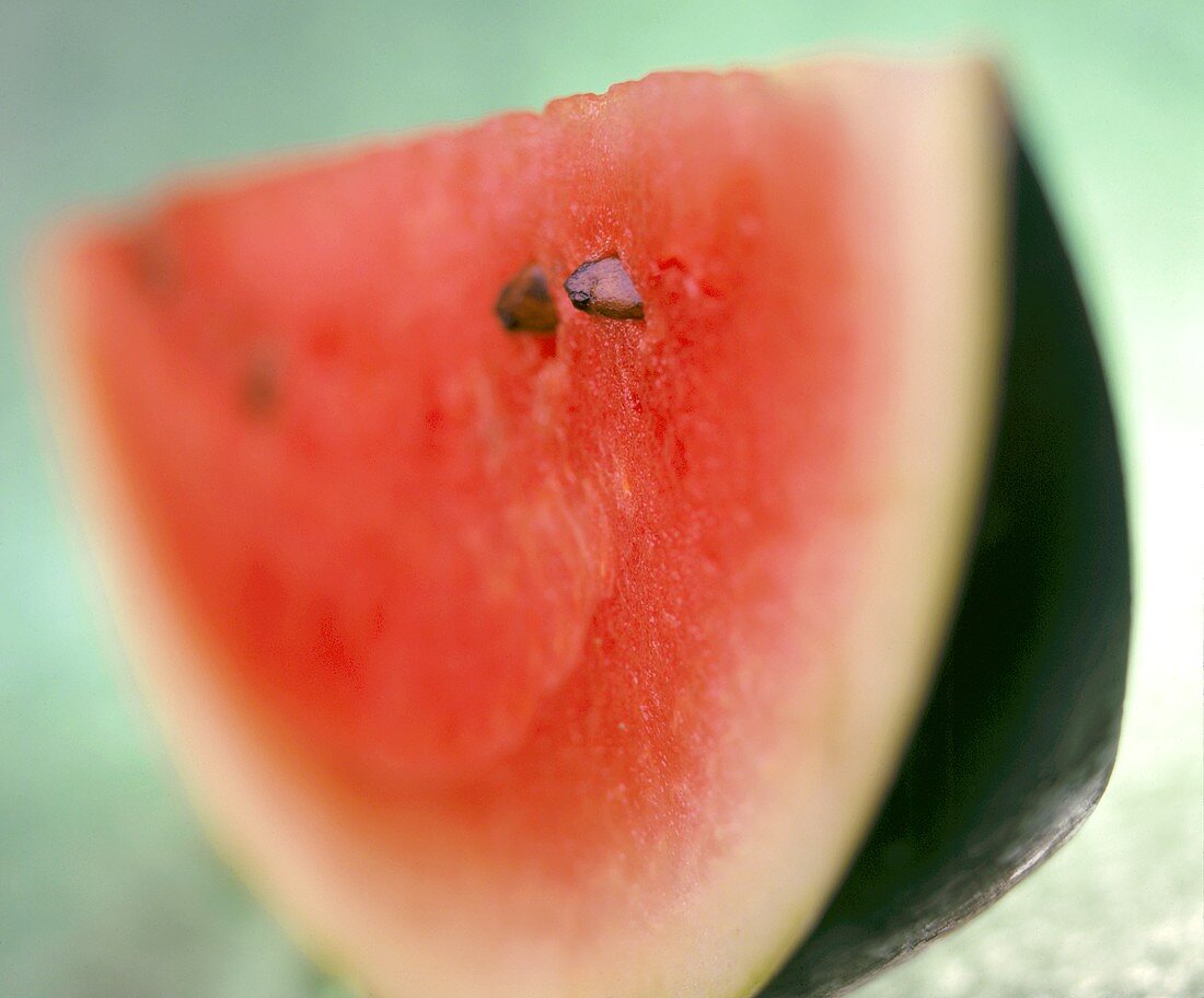 A thin segment of watermelon