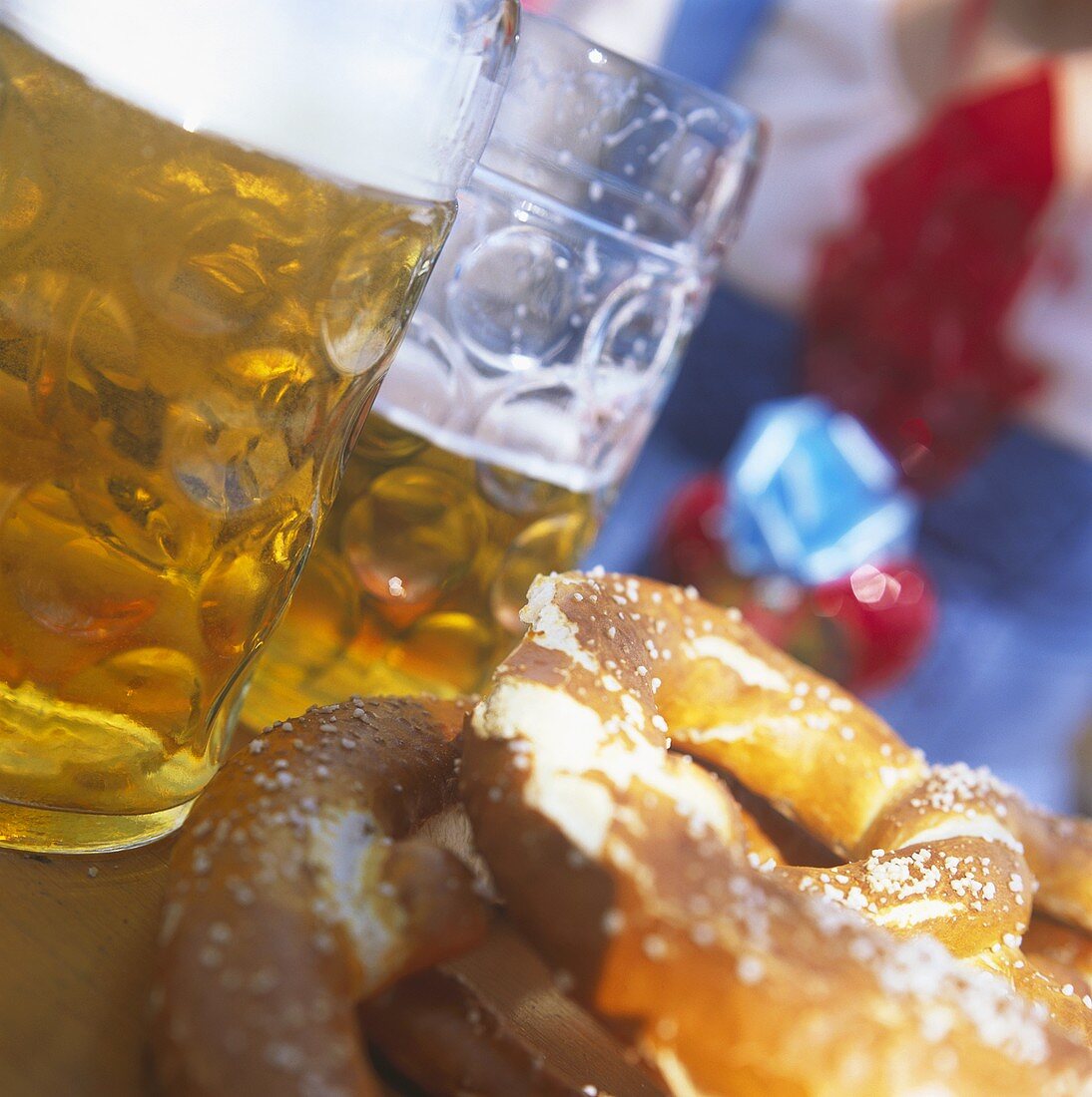 Two tankards and two pretzels on a table at October Festival