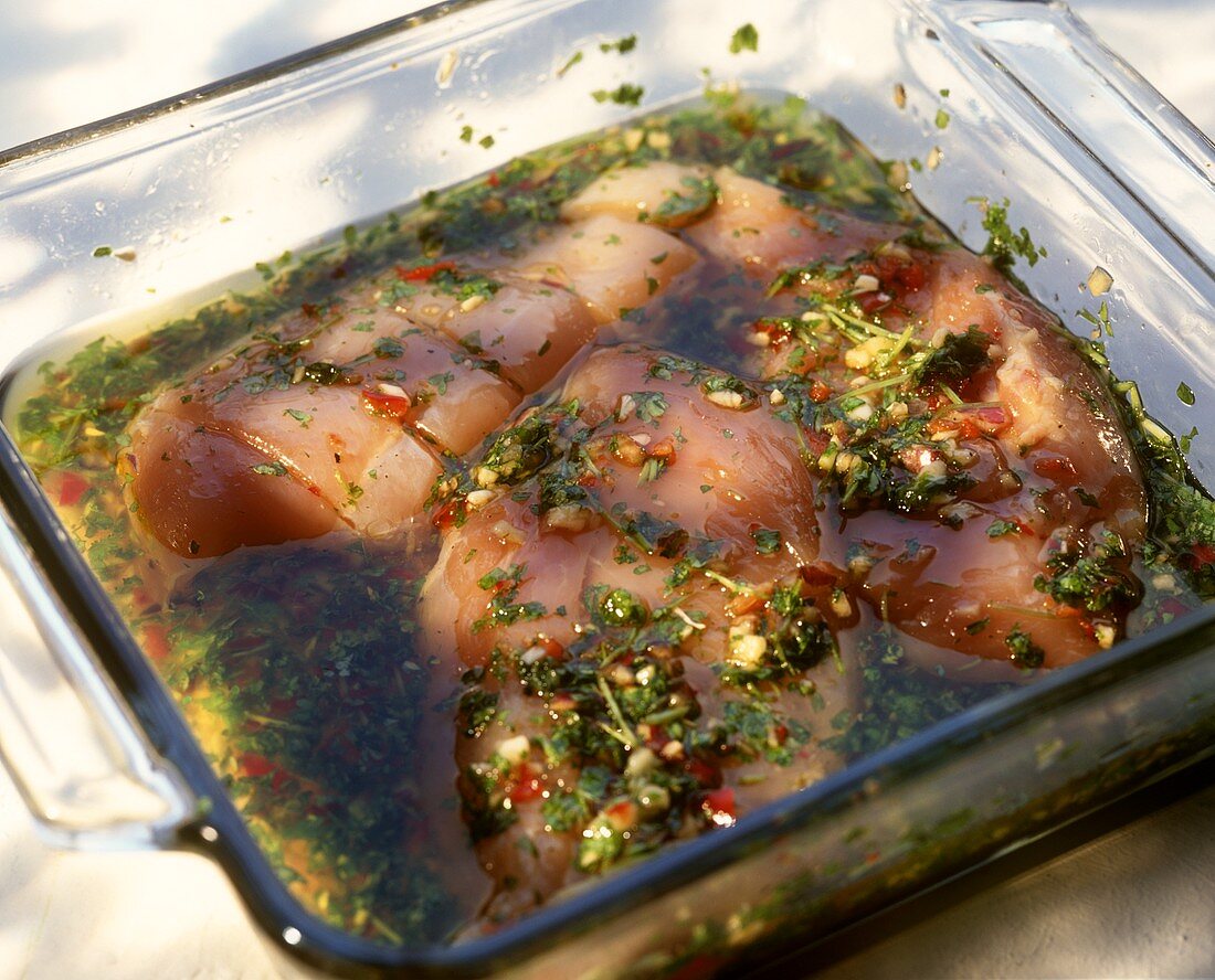 Marinated chicken breasts in a glass dish