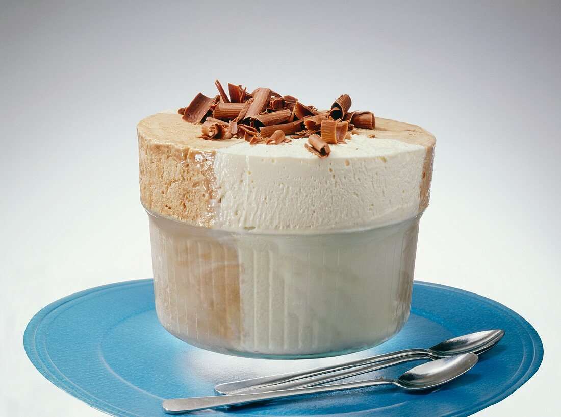 Ice cream souffle with grated chocolate in a glass dish
