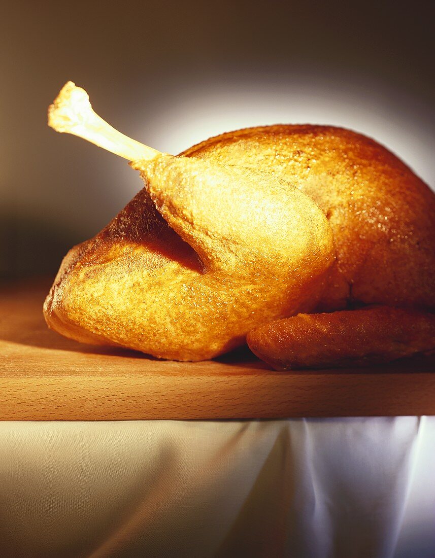 Roast turkey on wooden board