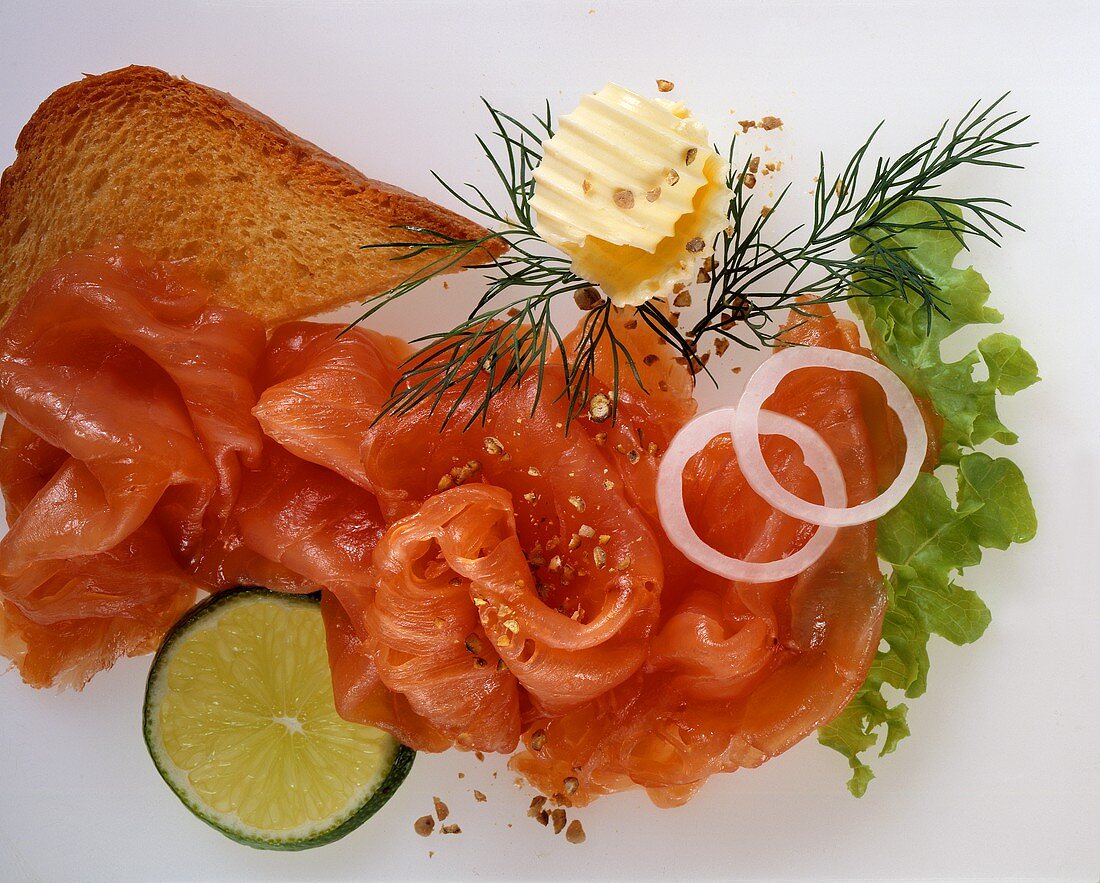 Salmon with toast, butter and lime slice