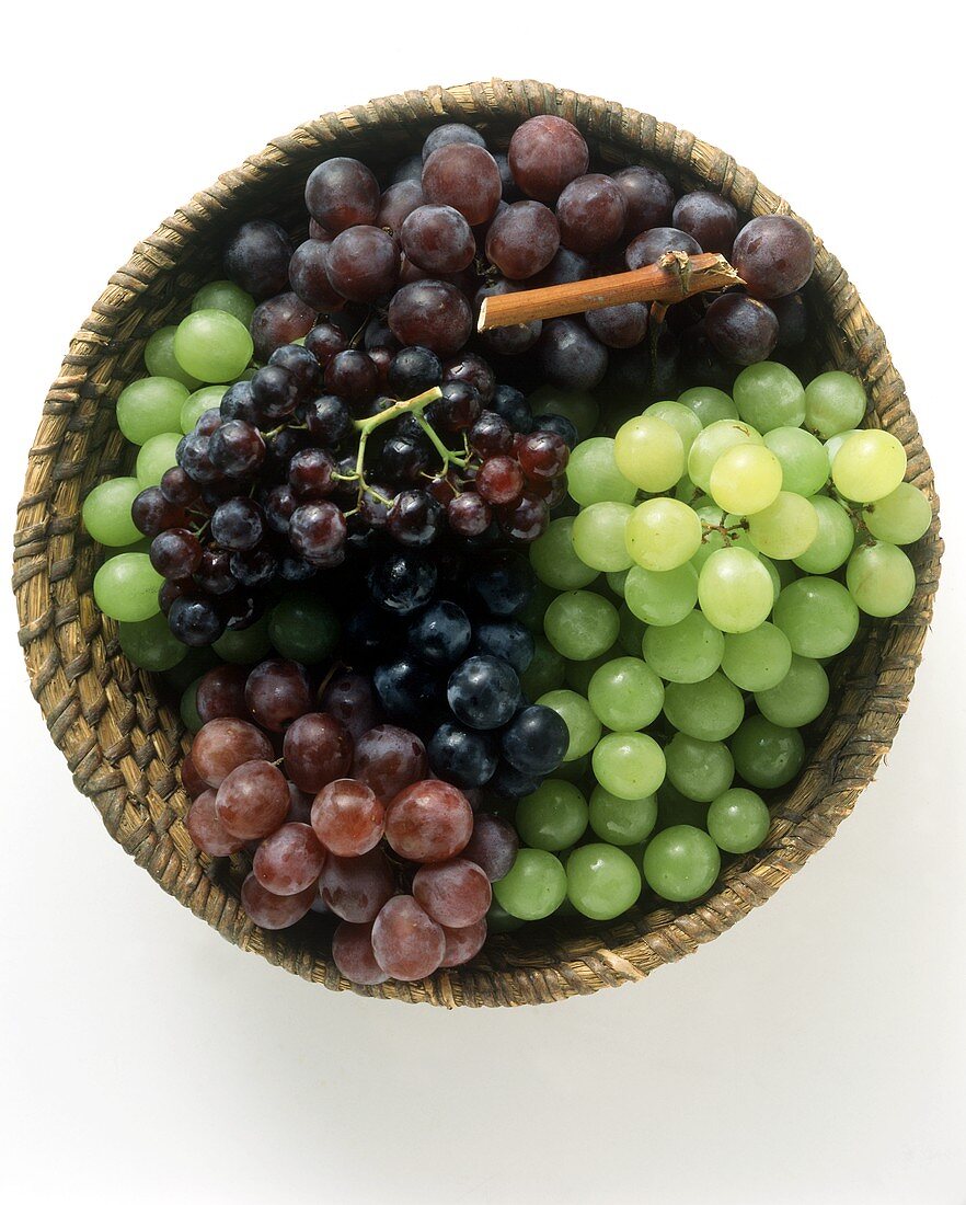 Green and red grapes in a basket