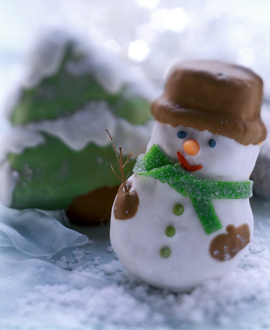 Snowman and fir tree biscuits, decorated with icing