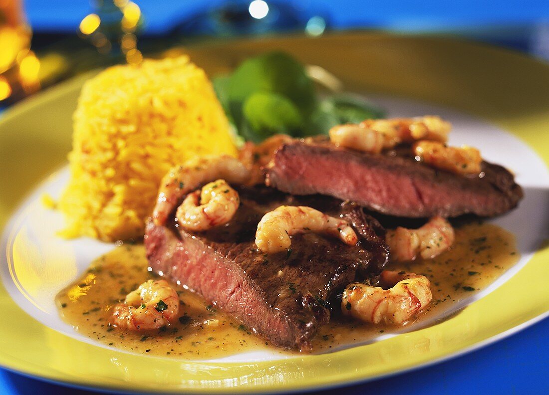 Steak and shrimps in Prosecco sauce with saffron rice