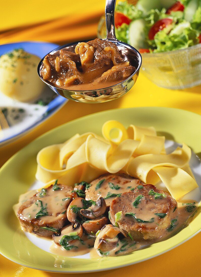 Fillet stew with mushrooms on plate; goulash on ladle