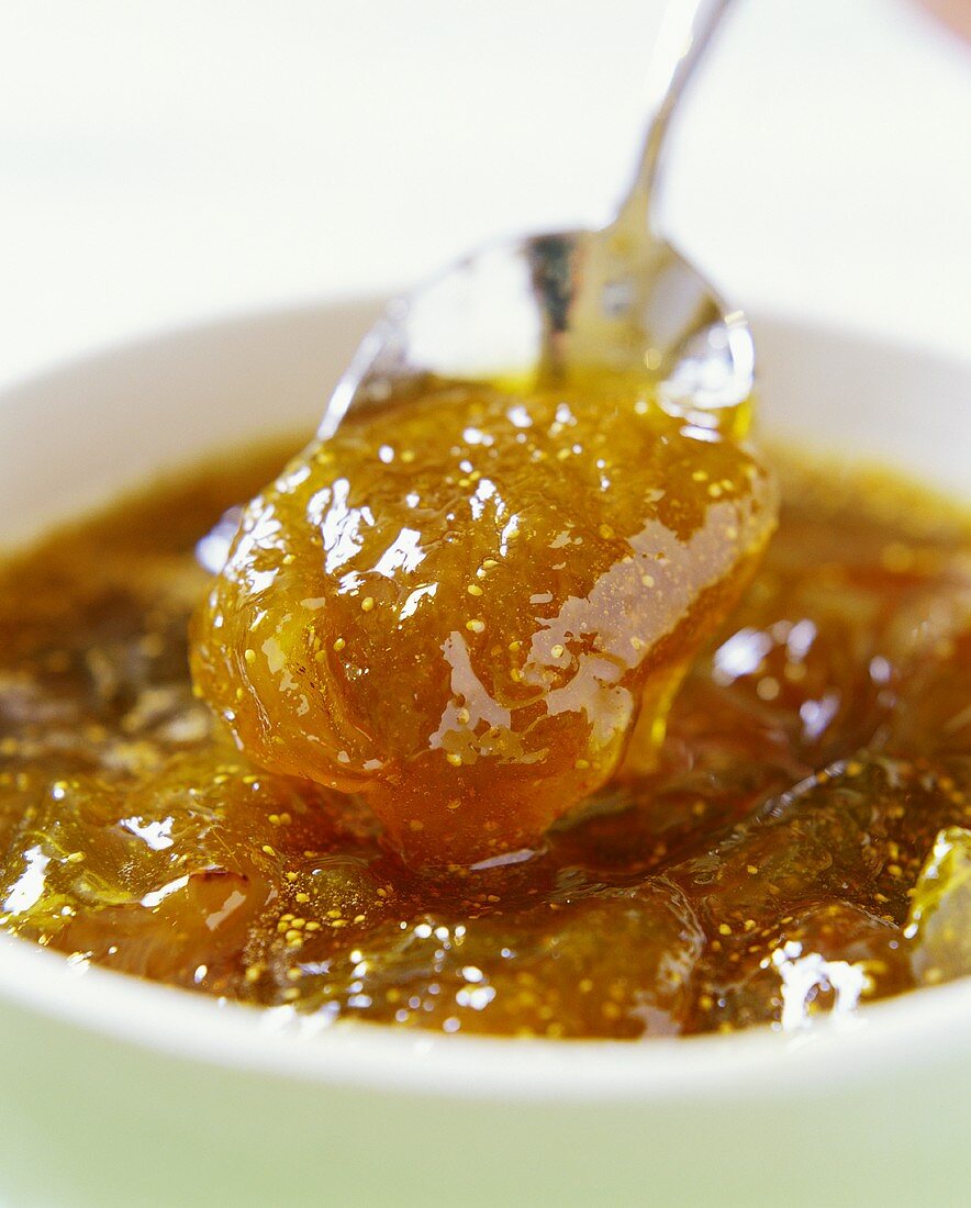 Fig jam on spoon and in bowl