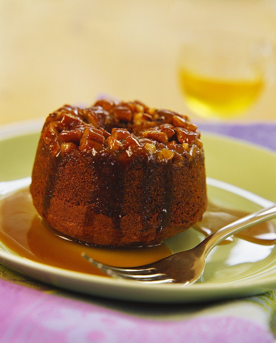 Small chocolate cake with nuts and syrup