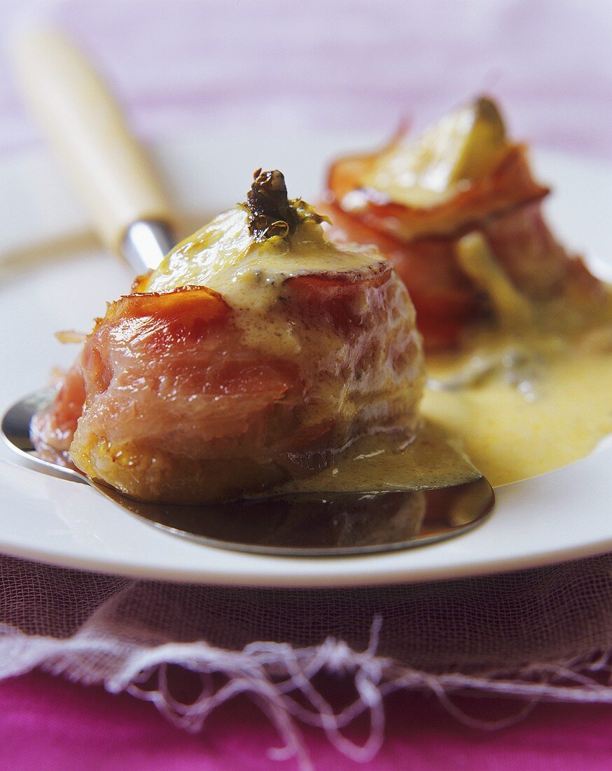 Bacon-wrapped figs, with toasted cheese topping
