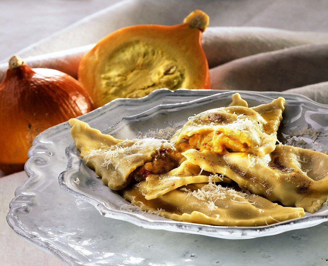 Pumpkin ravioli with mustard fruits and grated cheese