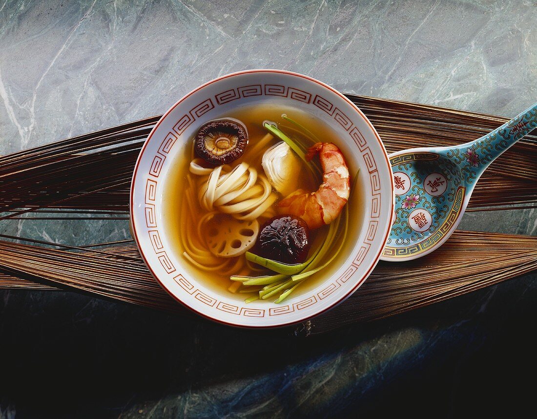 Chinese soup with shrimps, noodles and mushrooms