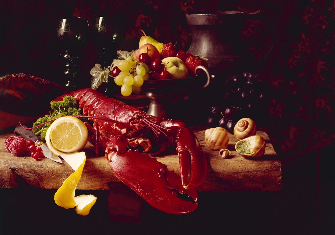 Still life with boiled lobster, fresh fruit and snails