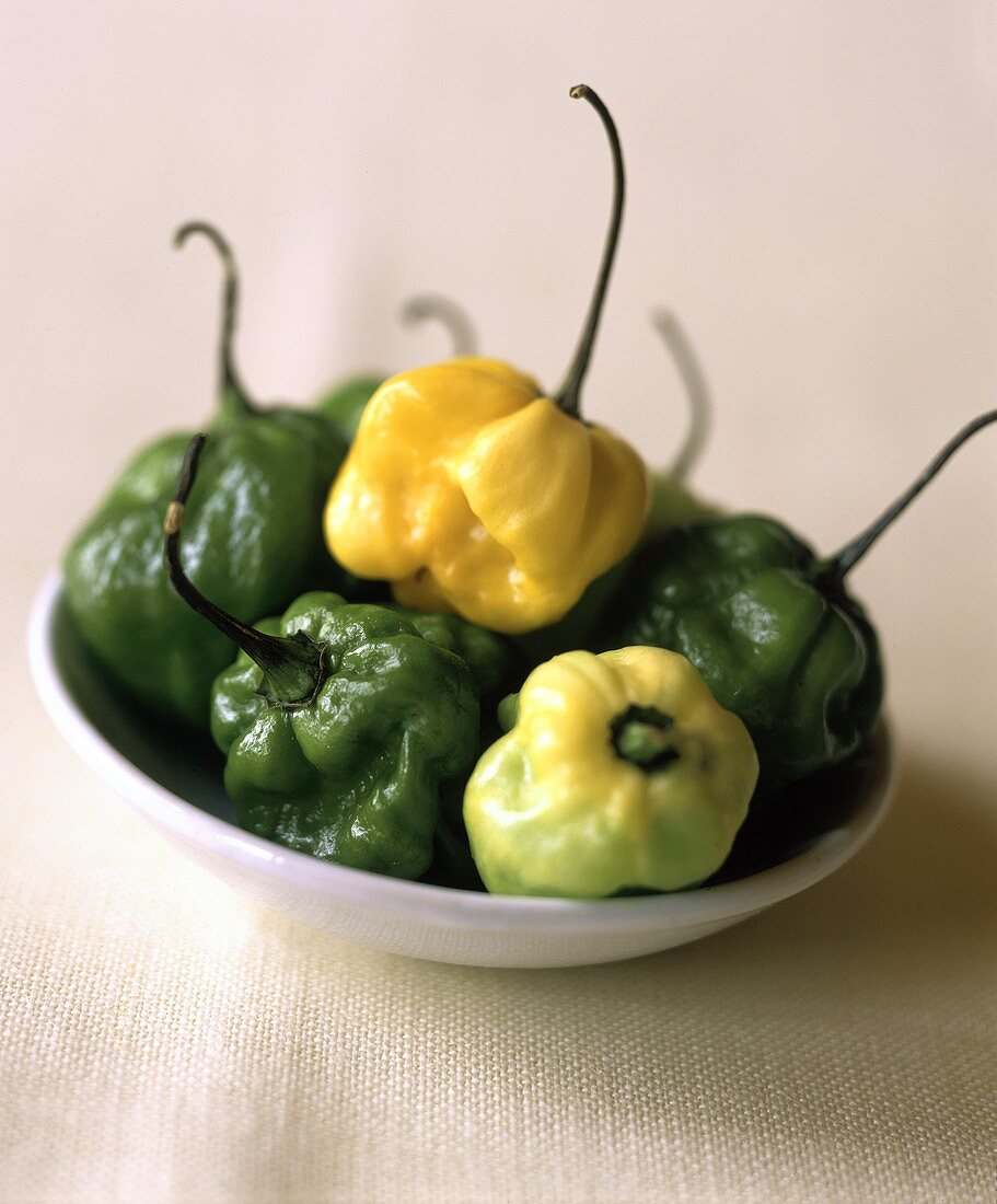 Yellow and green peppers on a white plate
