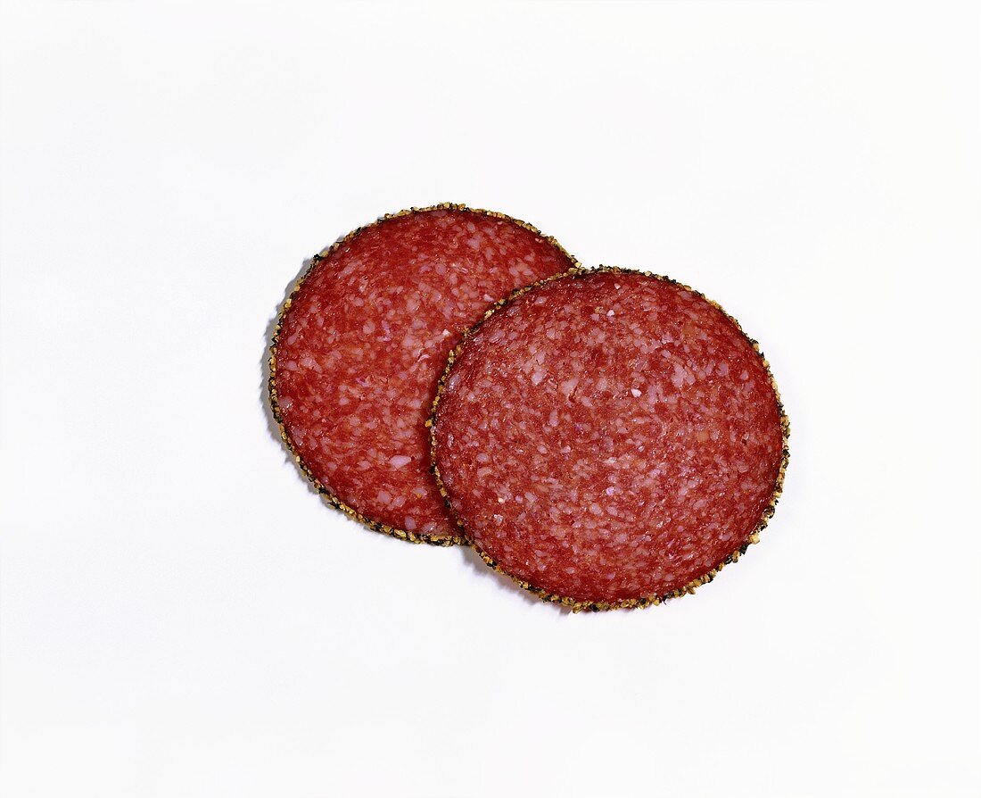 Two slices of pepper salami