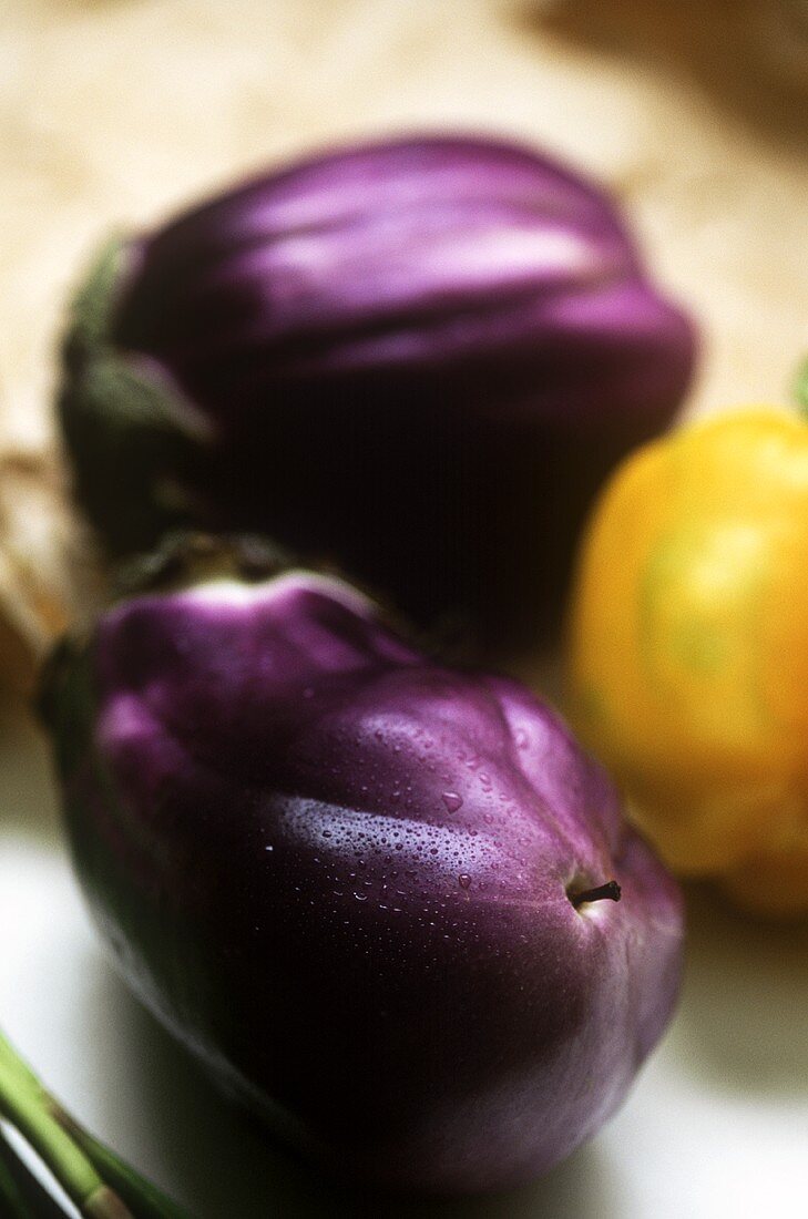 Aubergines and a yellow pepper