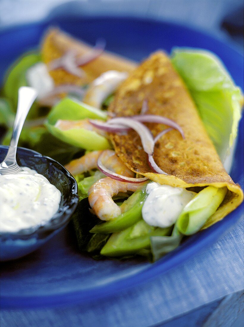 Filled pancakes with shrimps and green tomatoes