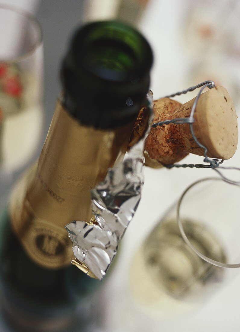 Opened champagne bottle with corks