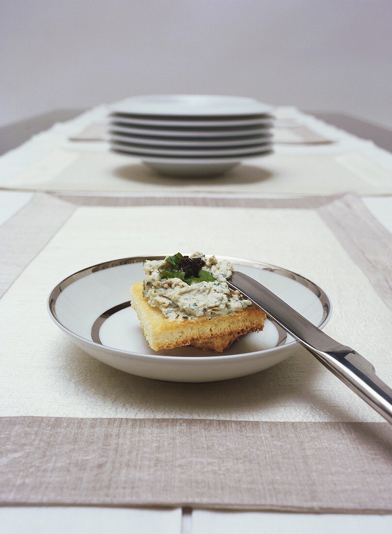 Crostini with herb soft cheese on plate