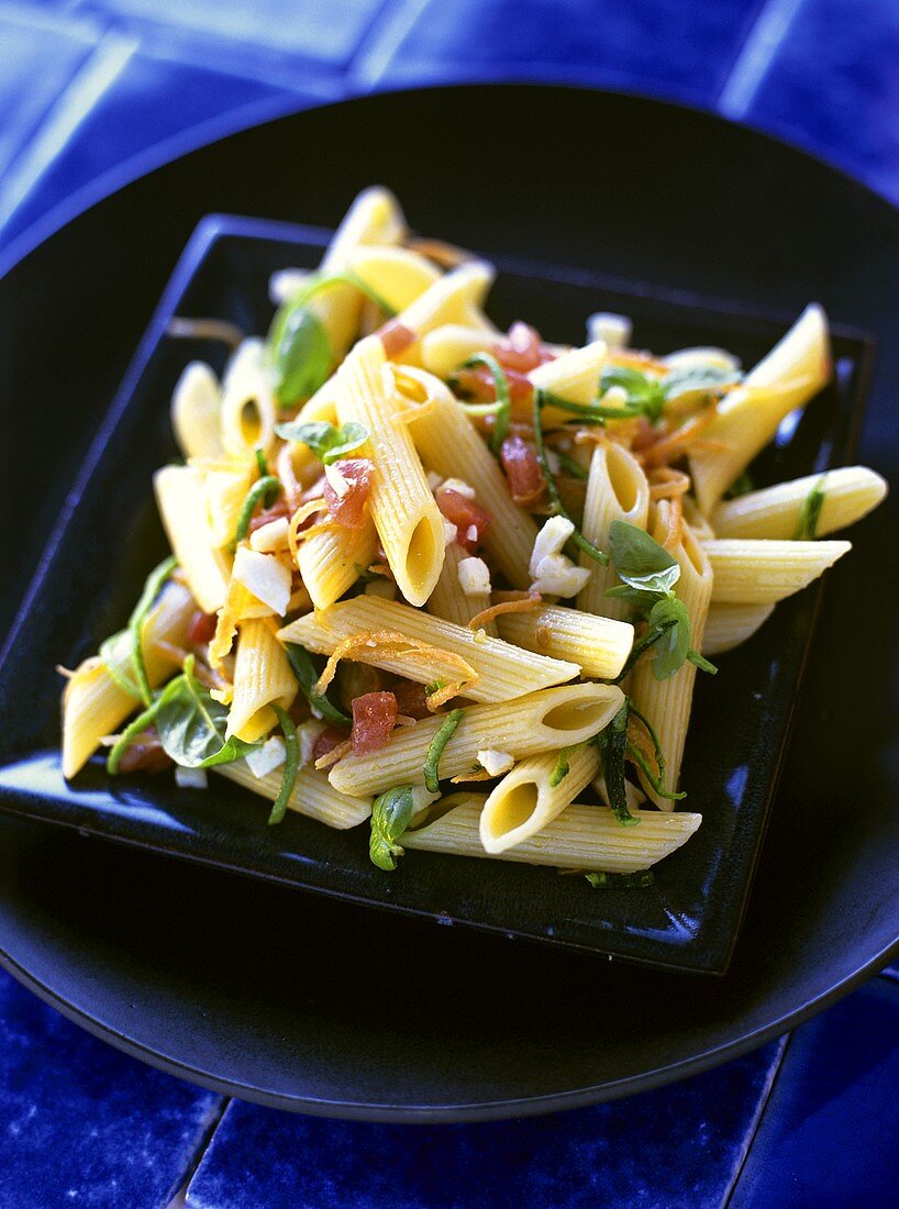 Penne with vegetables and basil