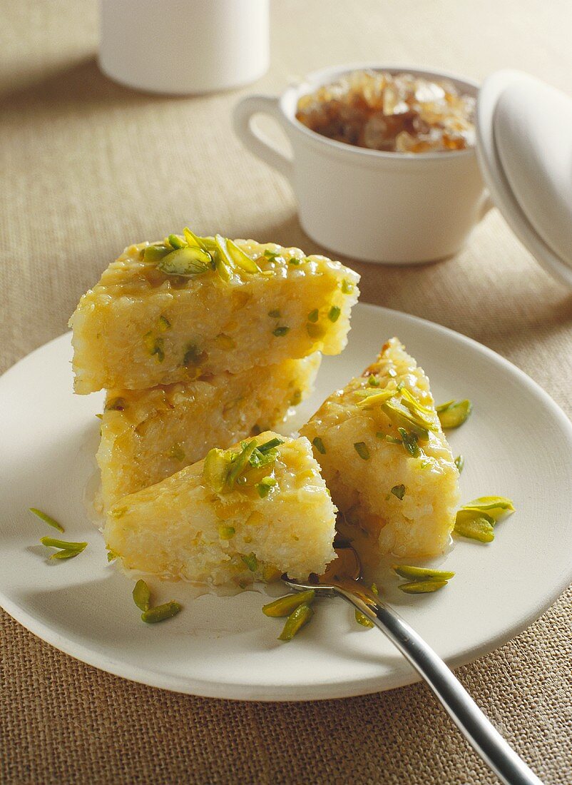 Coconut rice cake with chopped pistachios