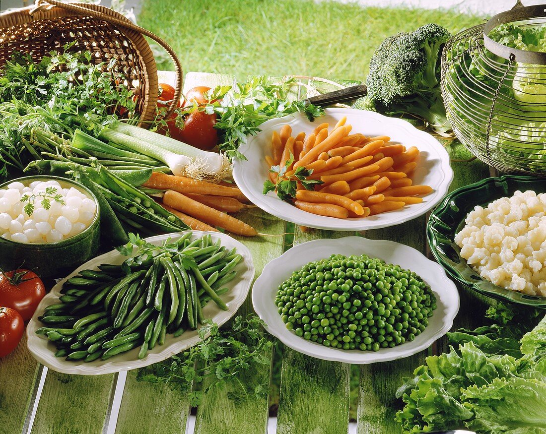 Still life with fresh and steamed vegetables