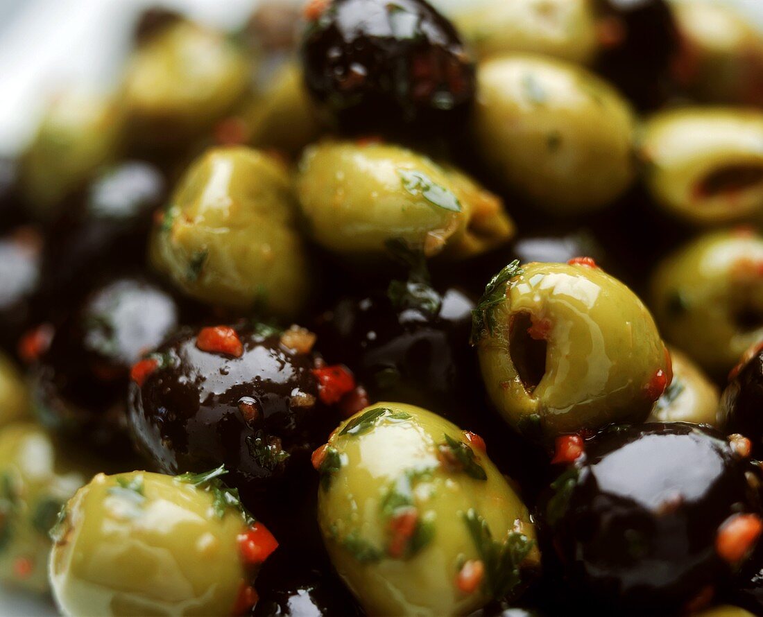 Marinated green and black olives