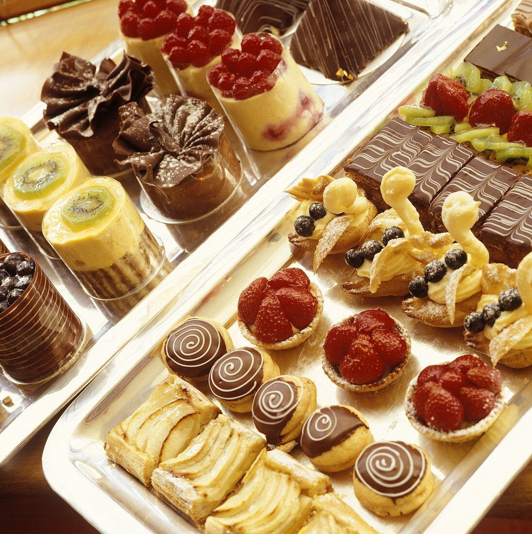 Various tartlets, pieces of cake and sweet pastries