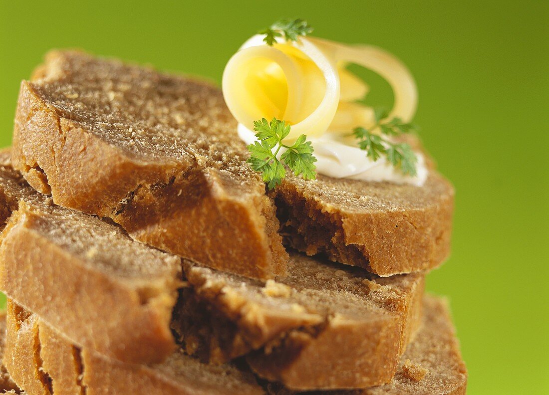 Slices of green rye bread, in a pile