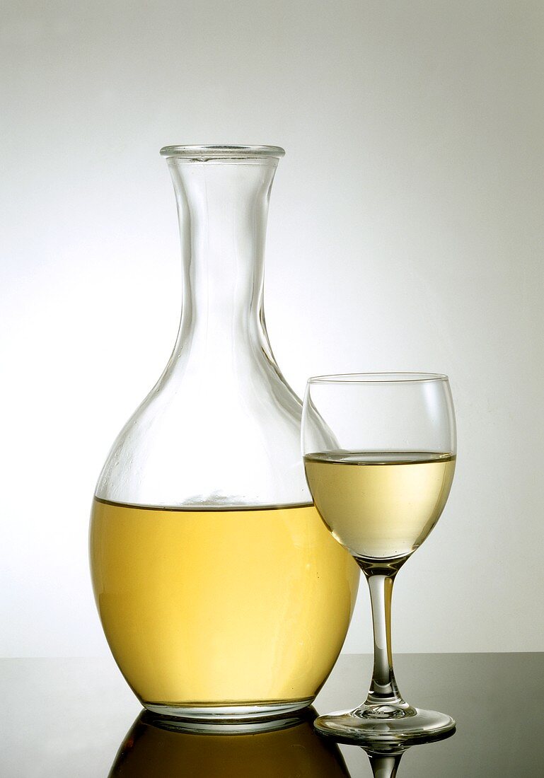 White wine in glass and carafe