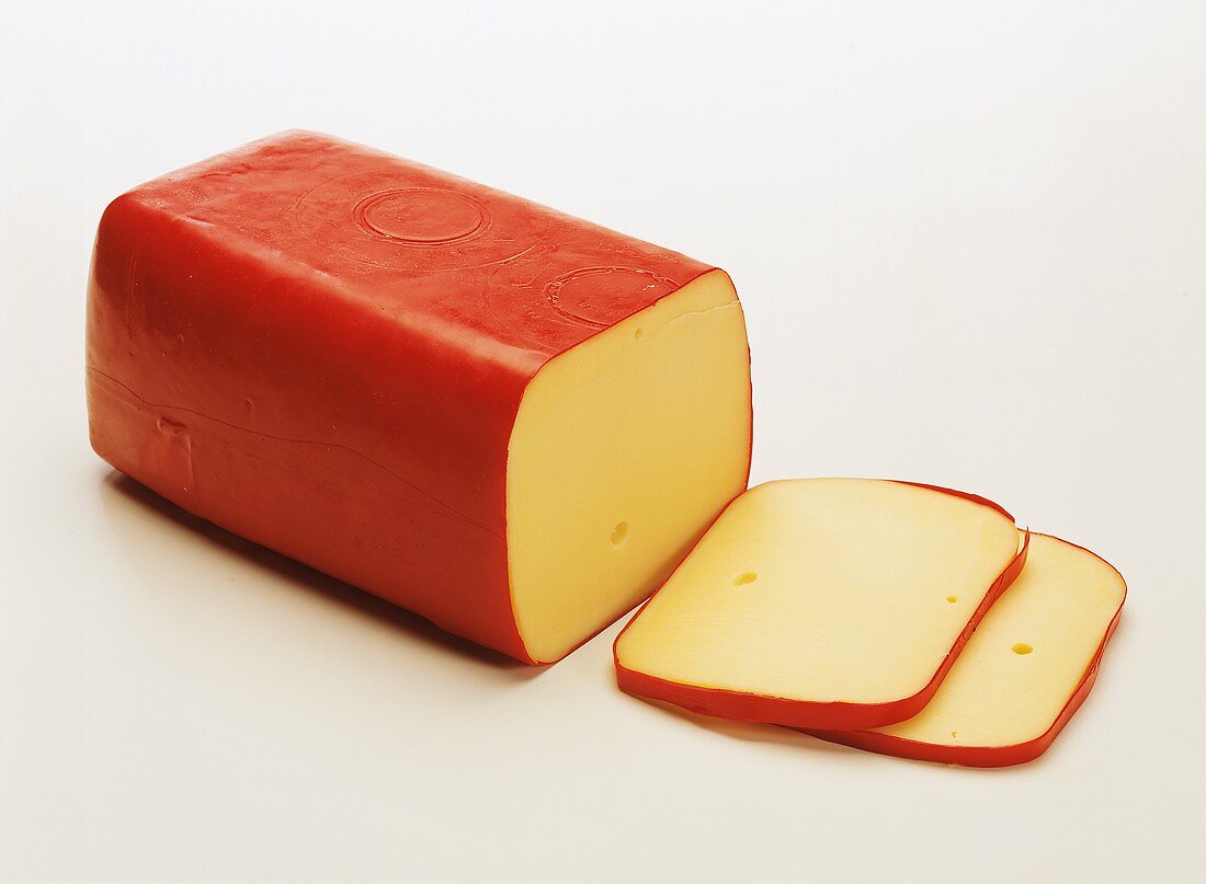 A block of Edam with two slices cut off