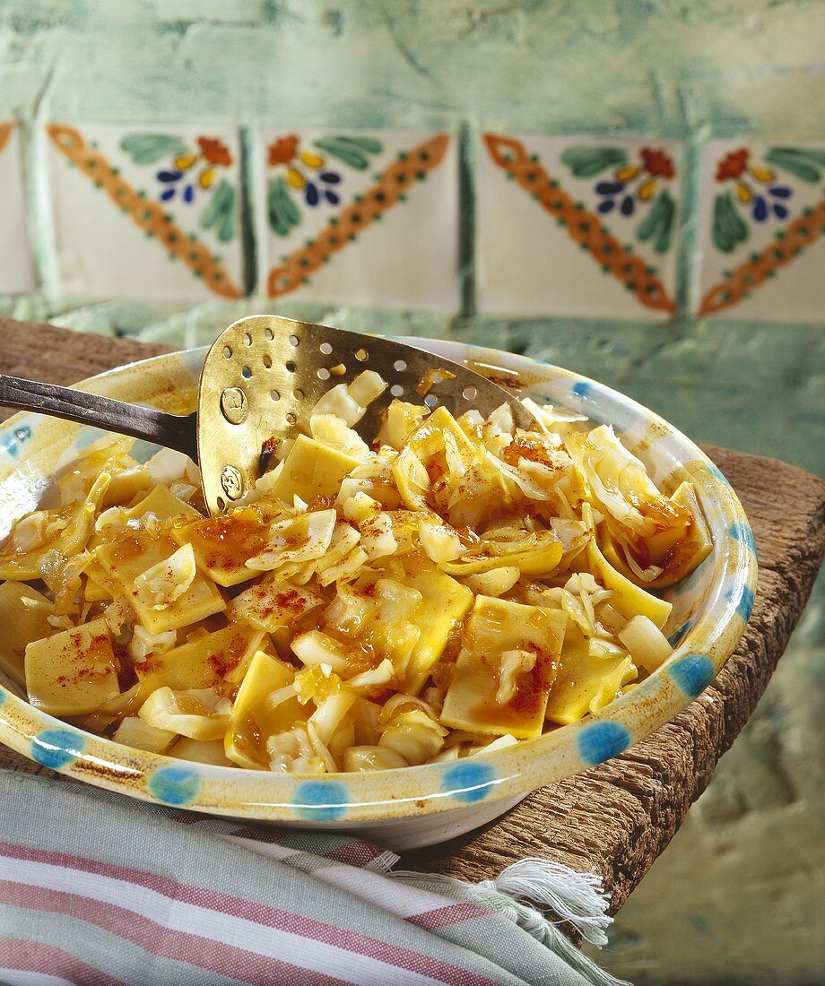 Pasta with cabbage, sprinkled with paprika, in deep plate