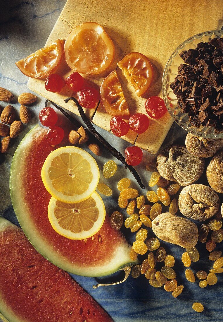 Still life with candied fruit, chocolate, raisins