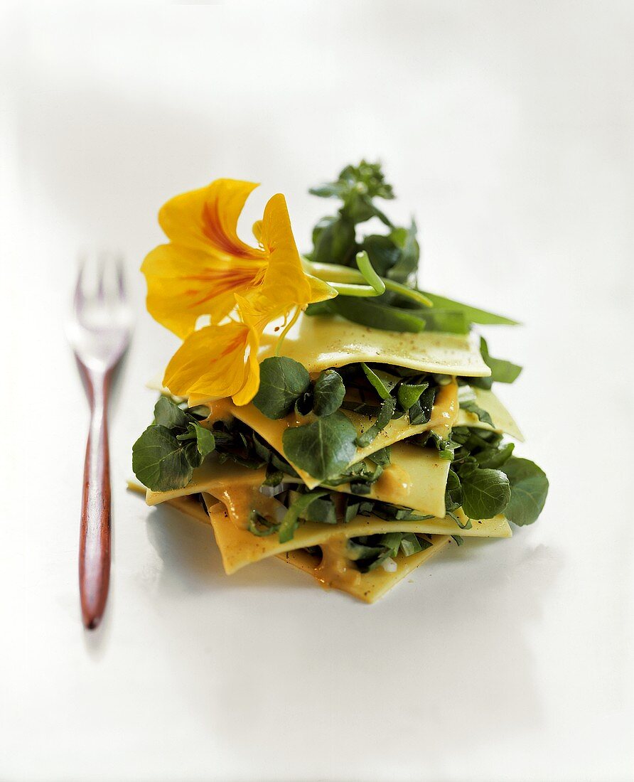 Open lasagne with wild herbs and yellow edible flowers