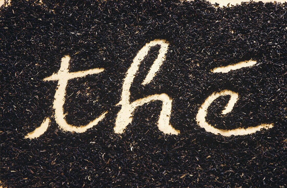 The word "the" (tea) written in tea leaves